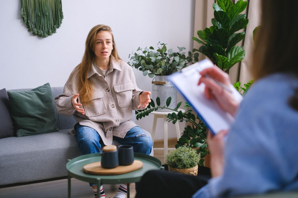 Hero image for Anxiety Treatment in Georgia — woman talking with a therapist during a session